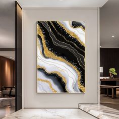 an abstract painting hangs on the wall in a modern living room with marbled flooring