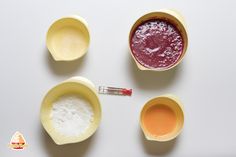 four bowls filled with different types of confection on a white surface, top view