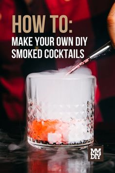 someone is making a drink in a glass with the words how to make your own diy smoked cocktails