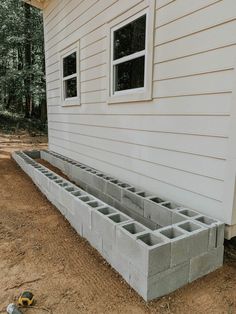 cinder blocks are placed on the side of a house