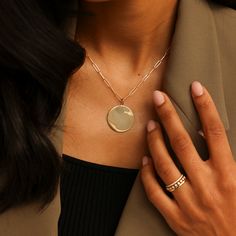 Our sleek and stylish DRD Paperclip Disc Charm Necklace adds modern sophistication to any look. The large, polished gold pendant pairs cleanly with our coveted 14 karat gold paperclip chain. This wear-with-everything necklace is a timeless addition to any neck stack. Want to make it more personal? Add engraving, or your favorite charms to make this piece truly unique! 14 Karat Gold Disc is 25.2mm in Diameter Adjustable Length 20" Paperclip Chain To add a heart to your engraving, use "*" in the text box above. Please note engraving will add up to 10 days to delivery time To add a custom charm, please email info@danarebeccadesigns.com Additional Charms Sold Separately 14k Gold Paperclip Chain Chain Length: 20" Links Measure 9.9mm x 2.5mm Lobster Clasp Sleek Jewelry Gift, Sleek Round Jewelry For Gift, Sleek 14k Yellow Gold Jewelry, Minimalist Jewelry With Polished Oval Link, Modern Gold-plated Jewelry With Paperclip Chain, Sleek Gold Jewelry Gift, Sleek Gold Jewelry As A Gift, Sleek Gold Jewelry For Gifts, Sleek White Gold Jewelry Gift