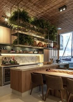 a kitchen with an island and lots of greenery on the shelves above it is next to a large window