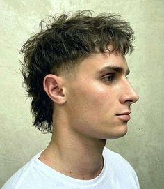 Messy Mullet. This modern mullet men’s haircut is a stylish, trendy and versatile look that will transform your style. The popular hairstyle offers a fresh approach for any guy looking to experiment with a new cut. Hockey Mullet Hairstyle Mens, Short Messy Mullet Men, Berlin Haircut Men, Mens Mini Mullet, Men’s Hairstyle Wolf Cut, Short Choppy Hair Men, Short Messy Mullet, Soccer Mullet