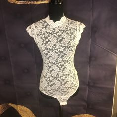 Lace Body Suit With Snap Closure... Comes In Black, White, Mauve And Burgundy... Items Are Brand New Since They Were Delivered In One Single Package There Are No Tags On Each Item. I Also Don't See Where You Can Purchase By Color So Please Indicate Size And Color In A Message I Have 3 Black , 10 Burgundy, 6 White And 6 Mauve Thank You. Feminine White Bodysuit For Party, White Lace Bodysuit With Lace Trim, White Stretch Bodysuit With Lace Trim, White Stretch Feminine Bodysuit, White Feminine Stretch Bodysuit, Spring White Lace Bodysuit, White Lace Bodysuit For Party, White Lace Party Bodysuit, Spring White Bodysuit With Lace Trim