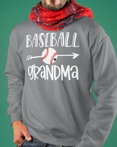 a man wearing a baseball grandma hoodie with an arrow and ball on the front