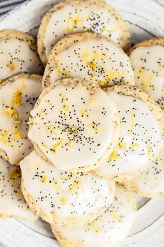 a white plate topped with lemon cookies covered in sprinkles