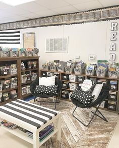 a room filled with lots of furniture and bookshelves full of books on shelves