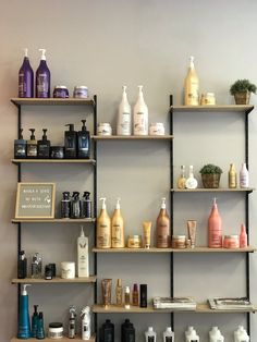 the shelves are filled with many different types of hair and body care products on them