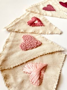 three pieces of fabric with hearts on them