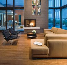 modern living room with wood flooring and large windows