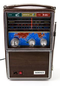 an old fashioned radio with the world map on it