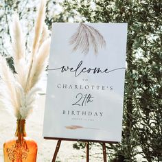 there is a sign that says welcome to charlotte's 21st birthday next to an orange vase