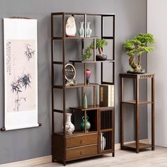 a living room with two shelving units and a painting on the wall