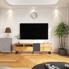 a living room with a large flat screen tv on the wall