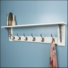 there is a coat rack with hooks on it