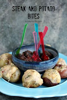 steak and potato bites on a blue plate with toothpicks in the bowl next to them