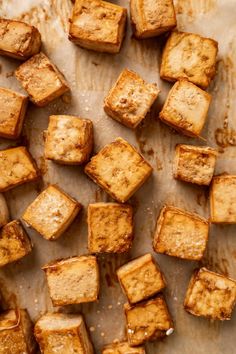 several pieces of bread sitting on top of a baking sheet