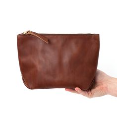 Timeless and classic, this monogrammed leather makeup bag is the perfect gift for your bridesmaids, your mom, or your best girlfriends! It's handmade with vegetable tanned leather and a premium zipper, so it's made to last! Brown Leather Clutch, Leather Makeup Bag, Brown Leather Bag, Leather Clutch Bags, Evening Clutch Bag