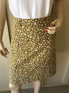 Vintage 1960's Skirt ~ Patty Woodard, California, Olive Green W/ Tiny Pink Flowers, Zips Up The Back With Big & Wide Belt Hoops Belt ~ Great Condition I will be mailing this Priority Mail and First Class International. Measurements Skirt Waist 24 Inch Hips Bone 32 Inch Tush 36 Length 21 Inch Retro Fitted Short Skirt, Spring Vintage Fashion Fitted Skirt, Fitted Vintage Fashion Skirt For Spring, Fitted Skirt For Spring Vintage Fashion, Vintage Fitted Cotton Skirt, Retro Spring Skirt With Pockets, Retro Fitted Skirt With Pockets, Retro Skirt With Pockets For Spring, Vintage Fitted Pleated Skirt