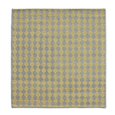 a yellow and grey rug on a white background with an image of a checkerboard pattern