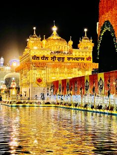 the golden temple is lit up at night