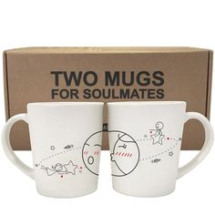 two mugs sitting next to each other in front of a box with the words two mugs for soulmates written on them