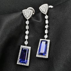 Styled with clean lines and symmetry, these limited-edition tanzanite earrings in 950 platinum resonate with iconic jewelry brands. Showcasing rare tanzanite gems of a unique taper baguette shape, these earrings are studded with top-quality diamonds for a sparkling contrast. These collectible earrings have an unmatched value for high-end jewelry connoisseurs. Luxury Tanzanite Earrings, Luxury Tanzanite White Gold Earrings, Luxury White Gold Tanzanite Earrings, Luxury Tanzanite Drop Earrings, Modern Sapphire Earrings For Formal Occasions, Elegant Tanzanite Formal Earrings, Elegant Tanzanite Earrings For Formal Occasions, Formal Tanzanite Earrings In Fine Jewelry Style, Iconic Jewelry