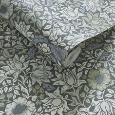 an image of a wallpaper pattern with flowers on the background in grey and white