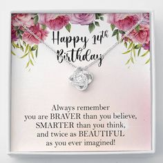 a happy 13th birthday card with pink roses and a silver heart pendant on it's chain