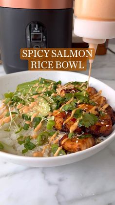 a bowl filled with rice and vegetables next to an air fryer