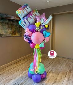 a birthday balloon bouquet with balloons and streamers