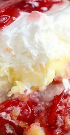 a piece of strawberry shortcake with whipped cream on top