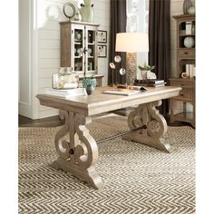 a wooden table sitting on top of a rug