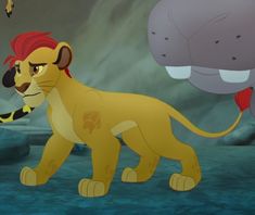 the lion and the mouse are standing next to each other in front of an elephant