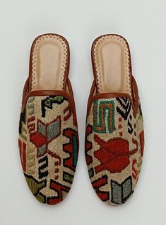 Welcome to AliDesignStore This Kilim Mules one -of-A-kind! Upper Made of a Hand-Selected Sumak Kilim Rug . Sumak Kilims Are Hand Crafted From a Mixture of Silk and Wool.and Have Stronger weave. - Handcrafted - Materials : Handwoven Sumak Kilim                        Leather Sole                        Leather Trimmed                       Leather Lining                       Stacked Leather Sole                       Rubber Under The Stacked Heel  Care:   Soft Clothing Brush İs Recomended To Clean The Slipper. İf Something Spill on it.You Can Clean İt a Cloth With shampoo. - Ships from a small business in Turkey Handmade Slip-on Mules, Artisan Handmade Slip-on Mules, Elegant Slip-on Mules With Stitched Sole, Mule Outfit, Leather Slip-on Mules With Stitched Sole, Brown Slip-on Mules With Stitched Sole, Heel Care, Soft Clothes, Stacked Heel