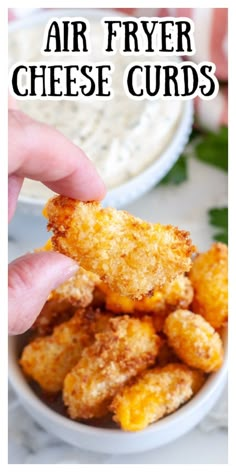 air fryer cheese curds in a white bowl with dipping sauce on the side