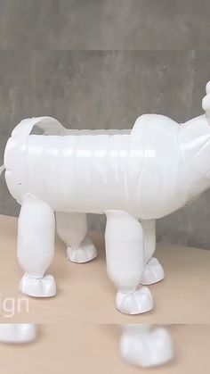 an inflatable dog is standing on a table