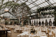 an indoor wedding venue with tables and chairs