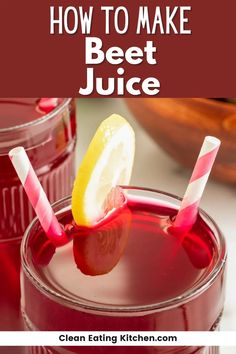 two glasses filled with beet juice on top of a white table next to an orange slice