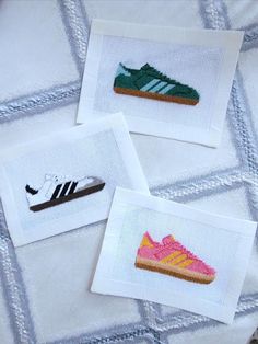 three cross stitch pictures with shoes on them