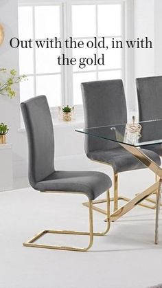 a glass table with four grey chairs and a plant in the background that says, outwith the old in with the gold