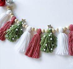 a christmas garland with tassels and decorations