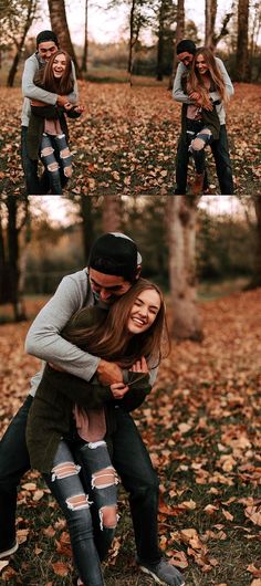 two people hugging each other in the woods with leaves on the ground and trees behind them