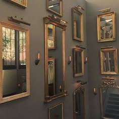 there are many different mirrors on the wall