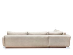 a white couch sitting on top of a wooden floor