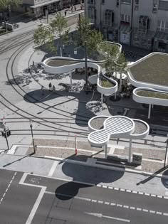 an aerial view of a train station and tracks