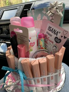 an assortment of personal care products in a basket on the dashboard of a car,