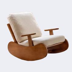 a wooden rocking chair with a white cushion