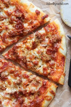 the pizza is cut into four pieces and ready to be eaten with a spatula