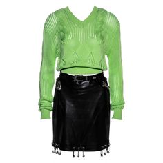 ▪ Gianni Versace runway ensemble ▪ Black leather pencil skirt ▪ Neon green knitted v-neck sweater ▪ Orange mesh cycling shorts with lace trim ▪ Large silver Medusa safety pin adornments ▪ IT 42 - FR 38 - UK 10 - US 6 ▪ Spring-Summer 1994 Safety Pin Skirt, Gianni Versace 90s, Shorts With Lace Trim, Versace 90s, Skirt And Sweater, Beige Pencil Skirt, Suits Outfits, Black Leather Pencil Skirt, Versace Runway